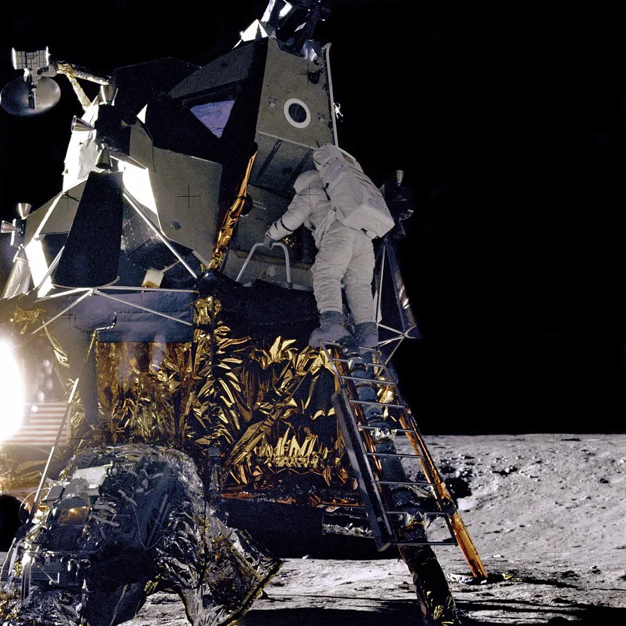 Alan Bean climbs down from the lunar module Intrepid, 19 November 1969, photographed by Pete Conrad.