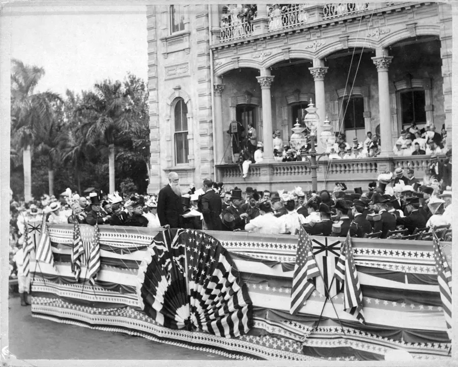 Crowds and flag-draped stands at the annexation ceremony on the steps of ʻIolani Palace, where Sanford Dole handed sovereignty to the US minister Harold Sewall
