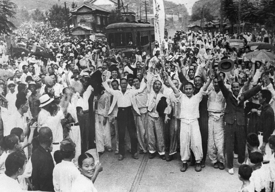 Crowds outside Seodaemun Prison in Seoul greet freed Korean independence activists on 16 August 1945, the day after liberation