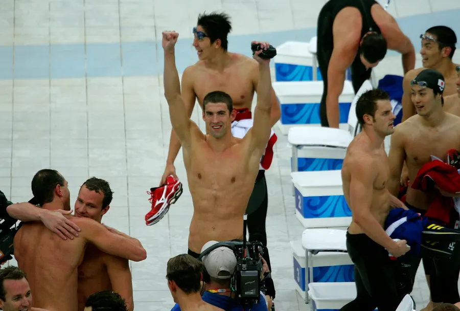 Michael Phelps and his relay team-mates celebrate the medley relay win that gave him his eighth gold medal in Beijing