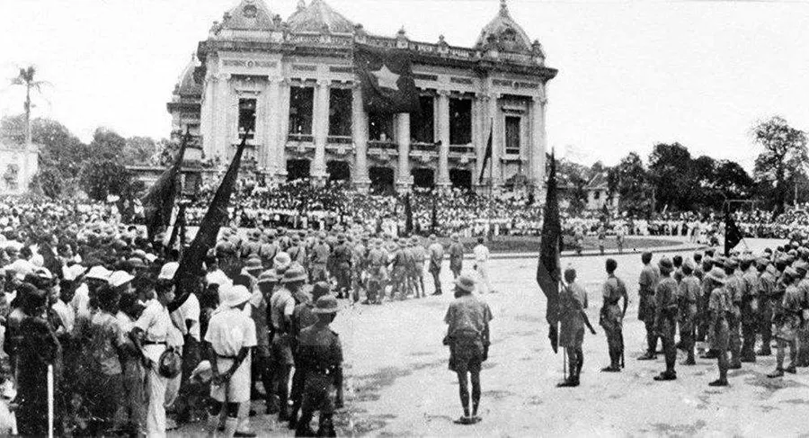 Crowds and Viet Minh troops outside the Hanoi Opera House at a rally celebrating the August Revolution in 1945