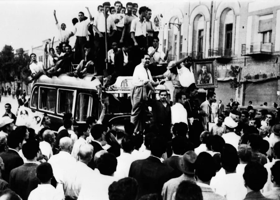 Crowds of the shah's supporters around a vehicle in Tehran during the coup of August 1953