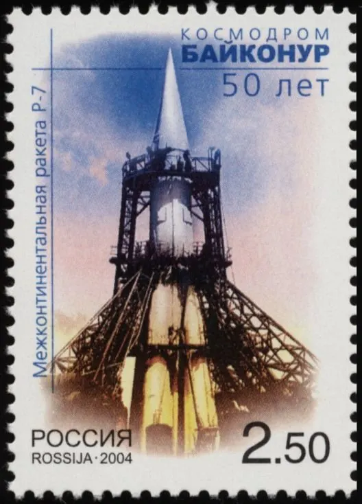 A Russian stamp of 2004 marking 50 years of the Baikonur Cosmodrome, showing an R-7 rocket on its launch pad