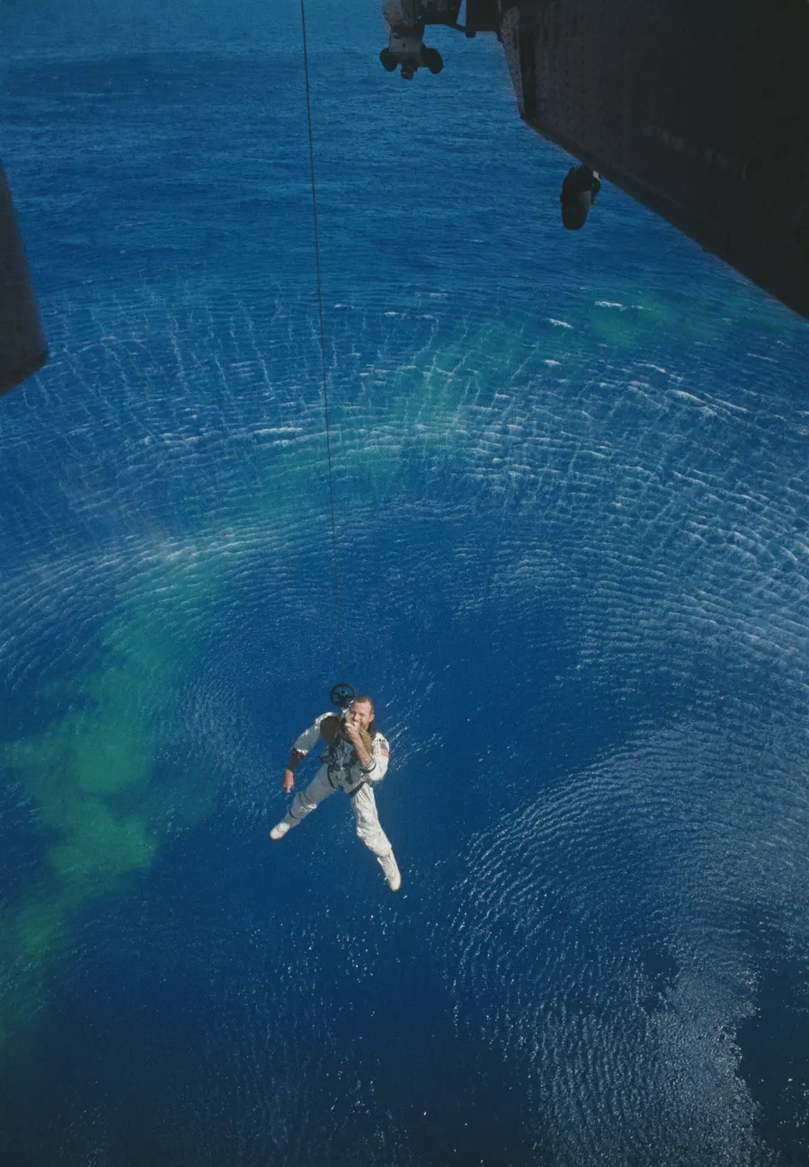 Gordon Cooper is hoisted up to a Navy helicopter from the Atlantic after the Gemini V splashdown on 29 August 1965