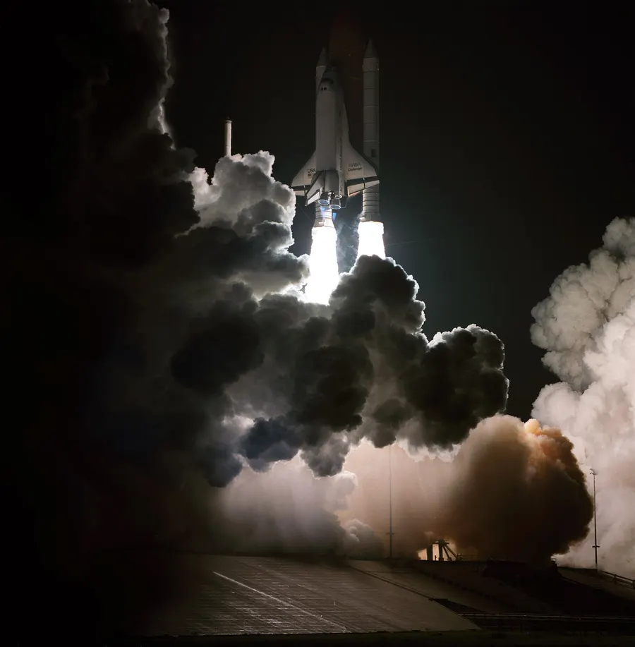 Space Shuttle Challenger lights up the sky as it lifts off on mission STS-8 at 2.32am on 30 August 1983