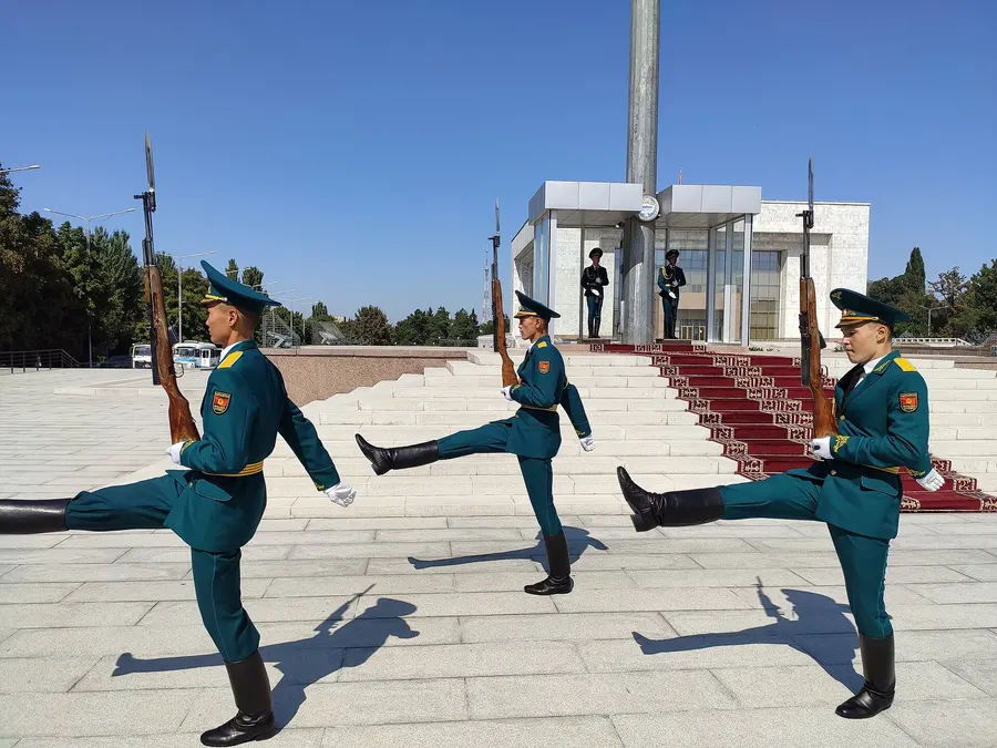 Soldiers guard the national flagpole on Ala-Too Square in Bishkek, Kyrgyzstan's capital, in 2019