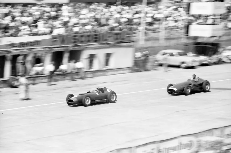 Juan Manuel Fangio's Maserati chases Peter Collins's Ferrari at the Nürburgring during the 1957 German Grand Prix