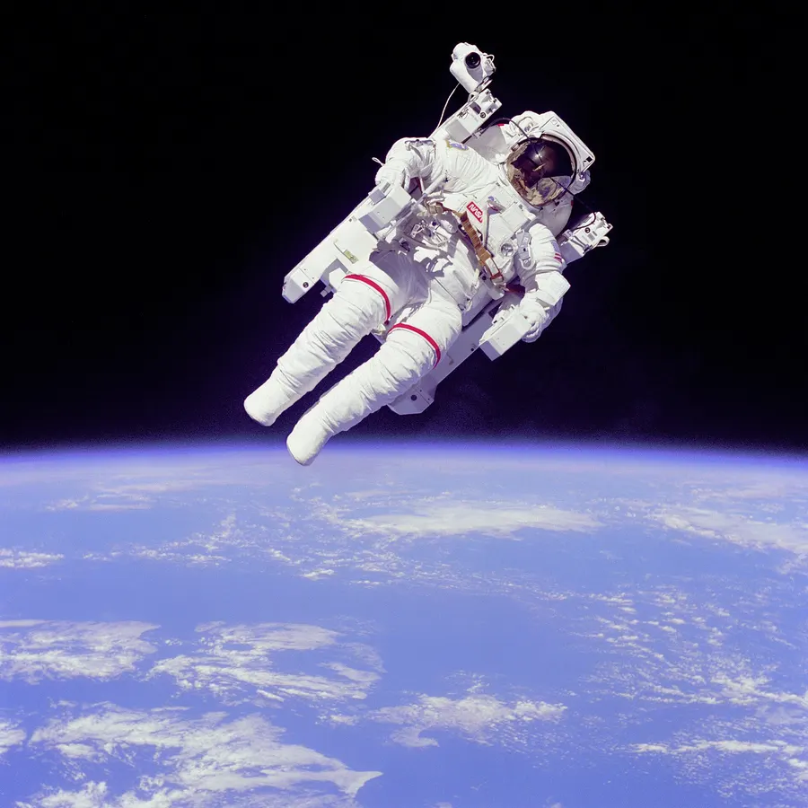 Bruce McCandless flying the Manned Maneuvering Unit above the Earth during the space shuttle mission STS-41-B, February 1984.