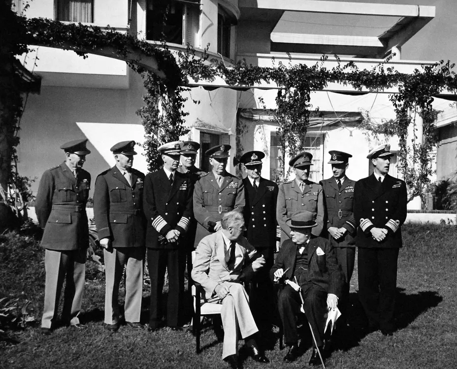 President Roosevelt and Prime Minister Churchill, seated, with their Combined Chiefs of Staff at the Casablanca Conference, January 1943.