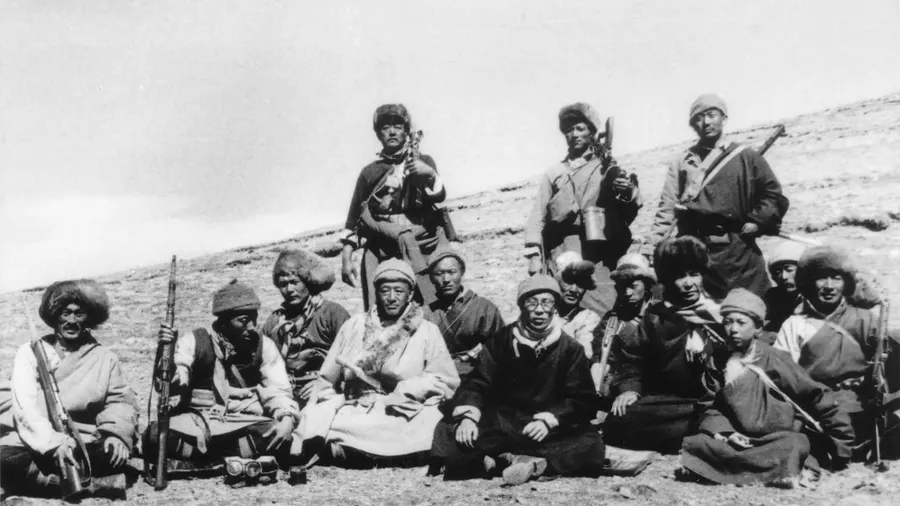 The Dalai Lama with members of the escort that protected him on his flight across the Himalayas, March 1959.