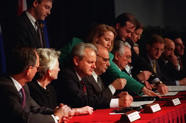 Slobodan Milošević, Alija Izetbegović and Franjo Tuđman initial the Dayton agreement, 21 November 1995.