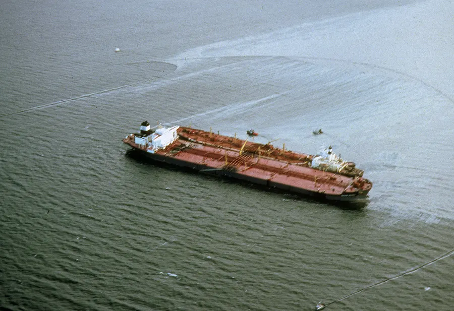 The Exxon Valdez and its spreading oil slick from the air, 1989.