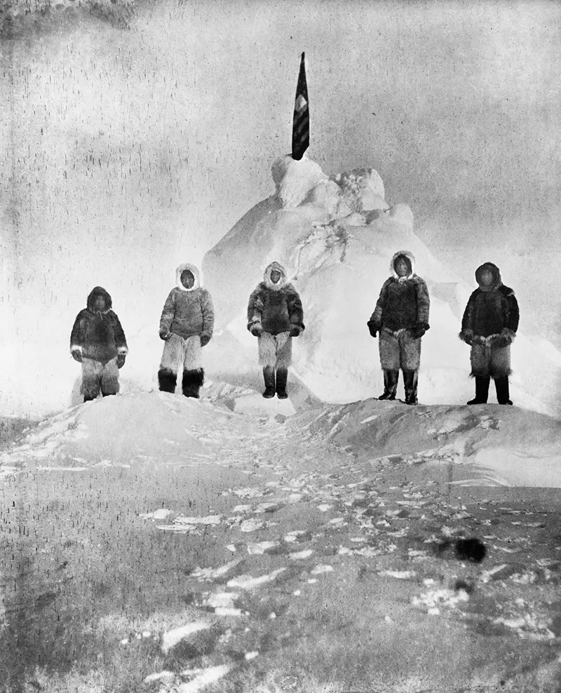 Matthew Henson (centre) and the four Inuit guides of Peary's expedition, photographed by Peary.