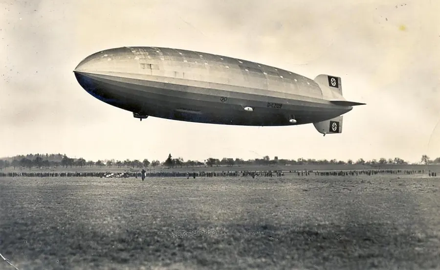 LZ 129 rising on its first flight at Friedrichshafen, 4 March 1936, on a postcard of the time.