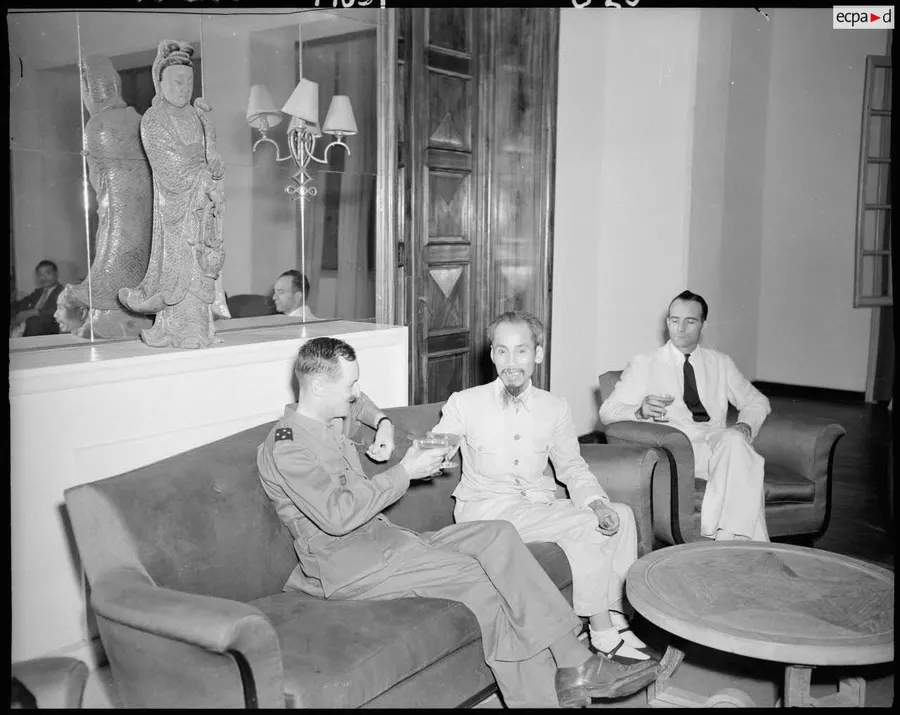 General Leclerc and President Ho Chi Minh raise a toast in Hanoi after French troops returned, March 1946.