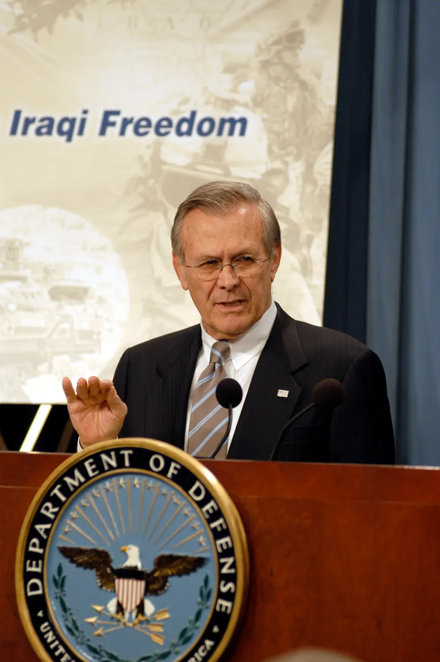 The US defence secretary Donald Rumsfeld answers questions about the air strikes on Baghdad, 21 March 2003.