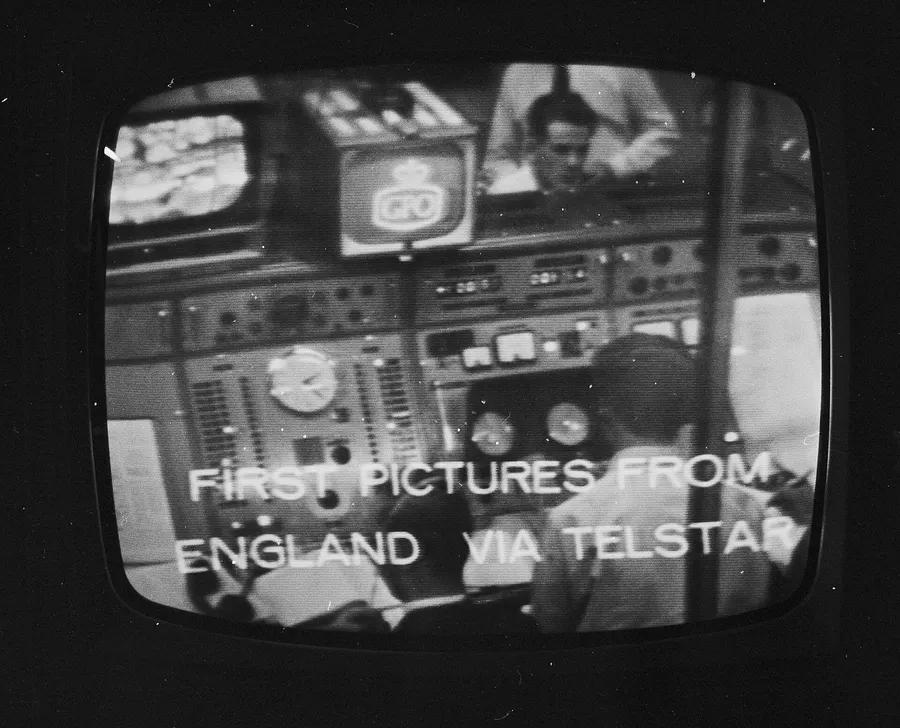 A television screen showing the words 'First pictures from England via Telstar' during a transmission test in 1962