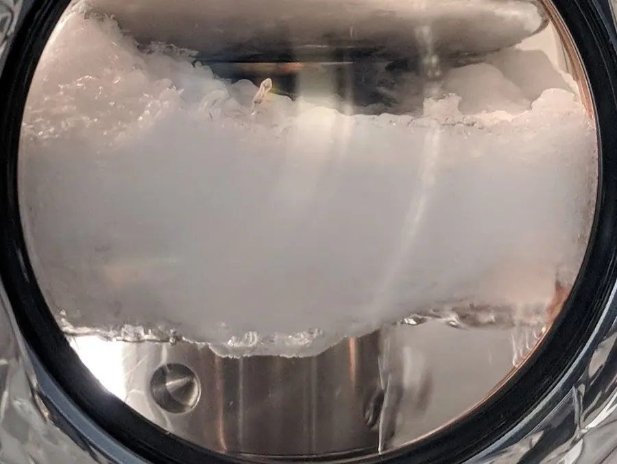 Solid and liquid xenon seen through the window of an insulated cell at Lawrence Berkeley National Laboratory