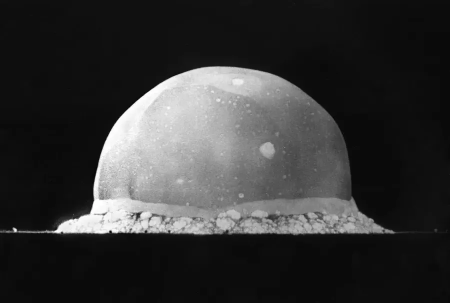 The Trinity fireball rising over the New Mexico desert, 16 milliseconds after the detonation