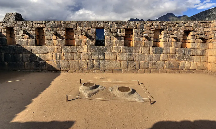Finely fitted Inca stonework at Machu Picchu, with niches set into the wall