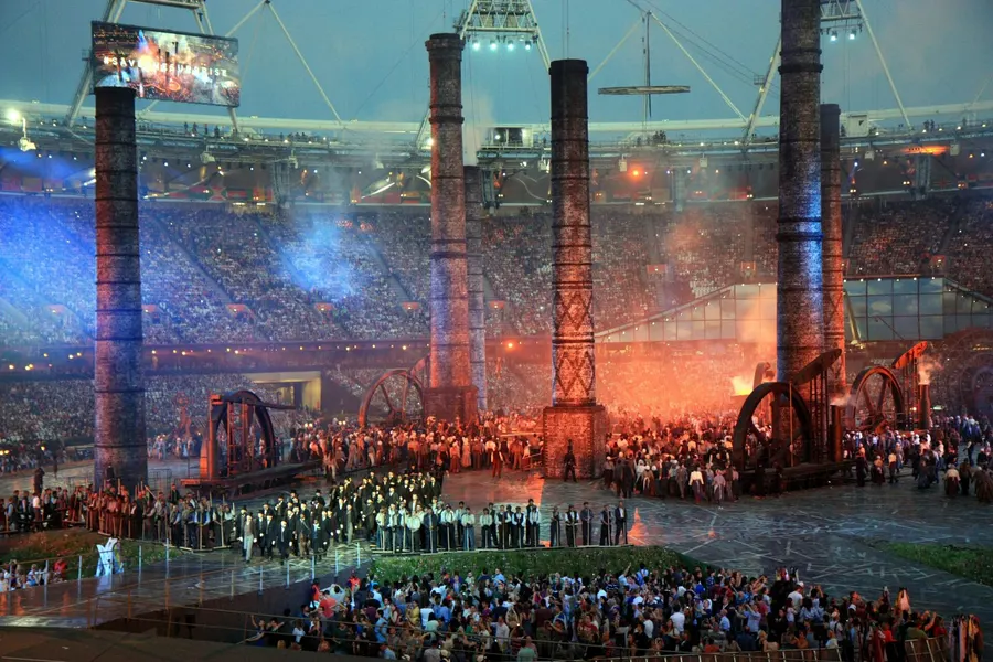 Chimneys rise from the Olympic Stadium during the Industrial Revolution scene of the London 2012 opening ceremony