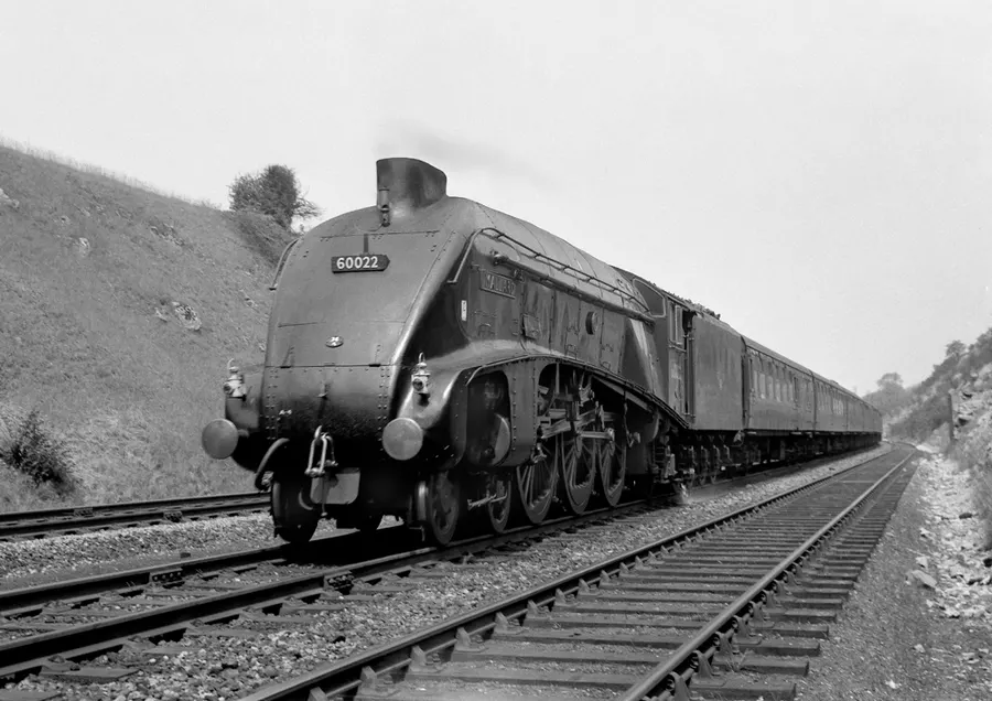 Mallard, by then numbered 60022, hauling a train down Stoke Bank in 1962, where it set its record in 1938