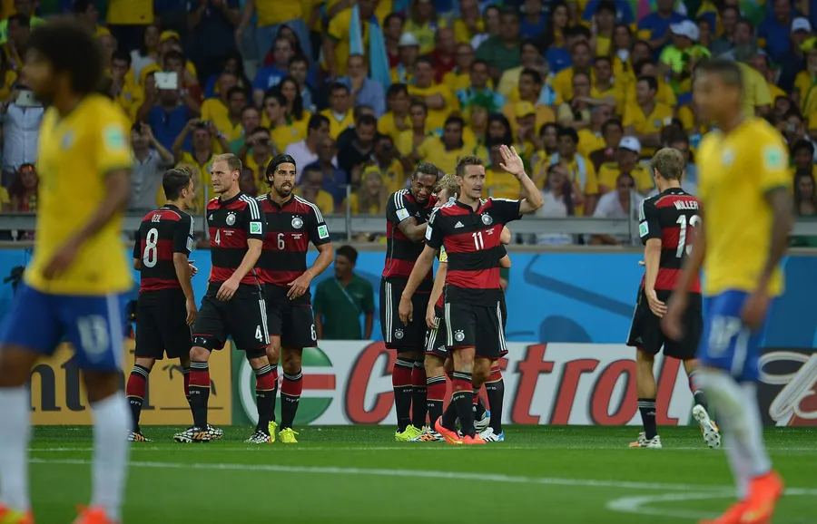 Germany's players celebrate a goal against Brazil at the Mineirão in Belo Horizonte on 8 July 2014