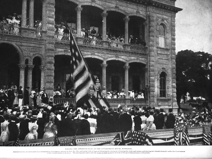 Crowds watch the American flag raised over Iolani Palace in Honolulu at the annexation ceremony of 1898