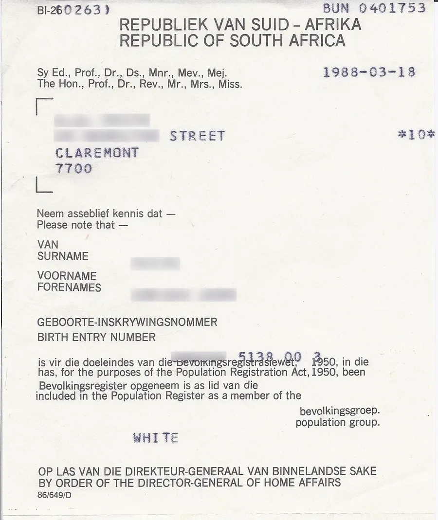 A South African population registration certificate issued in 1988, recording its holder's racial classification (personal details blanked out)
