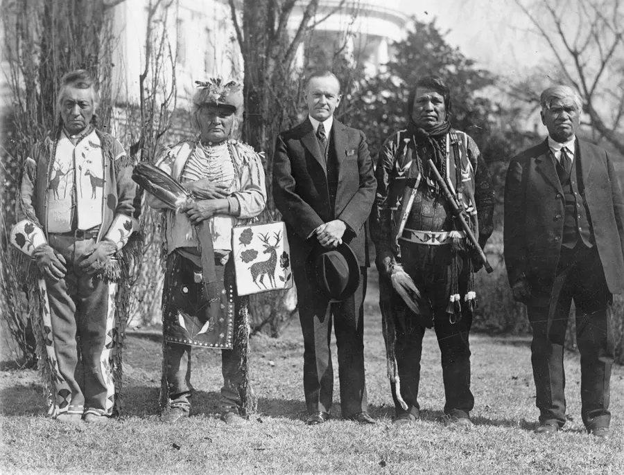 President Calvin Coolidge with four Osage men outside the White House in 1924, the year of the Indian Citizenship Act