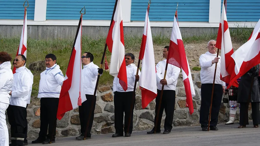 Flag bearers with the Greenlandic flag at National Day celebrations in Sisimiut, Greenland, on 21 June 2010, the first anniversary of self-rule