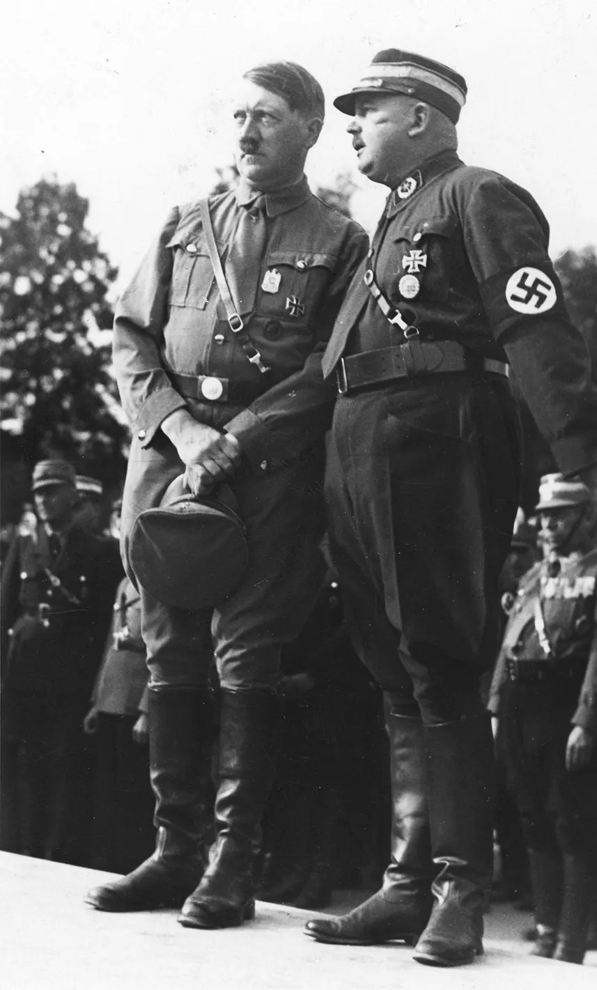 Adolf Hitler with the SA leader Ernst Röhm at the Nazi Party rally in Nuremberg in 1933, a year before the purge