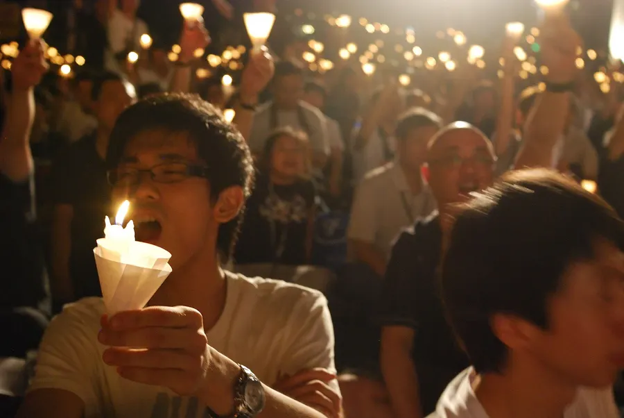 People holding candles at the annual vigil in Hong Kong's Victoria Park remembering 4 June 1989, photographed in 2009