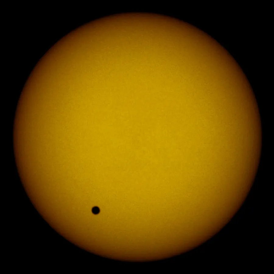 Venus, the small black disc near the lower left, crossing the face of the Sun on 8 June 2004