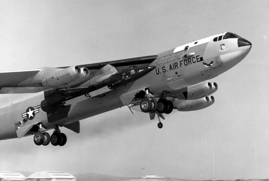 An X-15 slung beneath the wing of its B-52 carrier aircraft