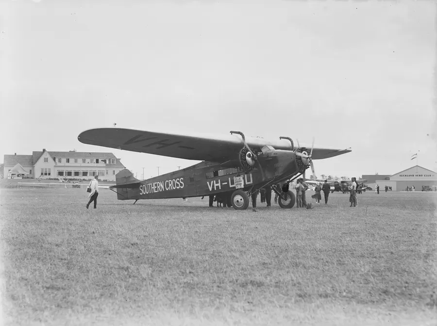 The Southern Cross (VH-USU), the Fokker trimotor in which Kingsford Smith's crew flew the Pacific, with onlookers at an airfield