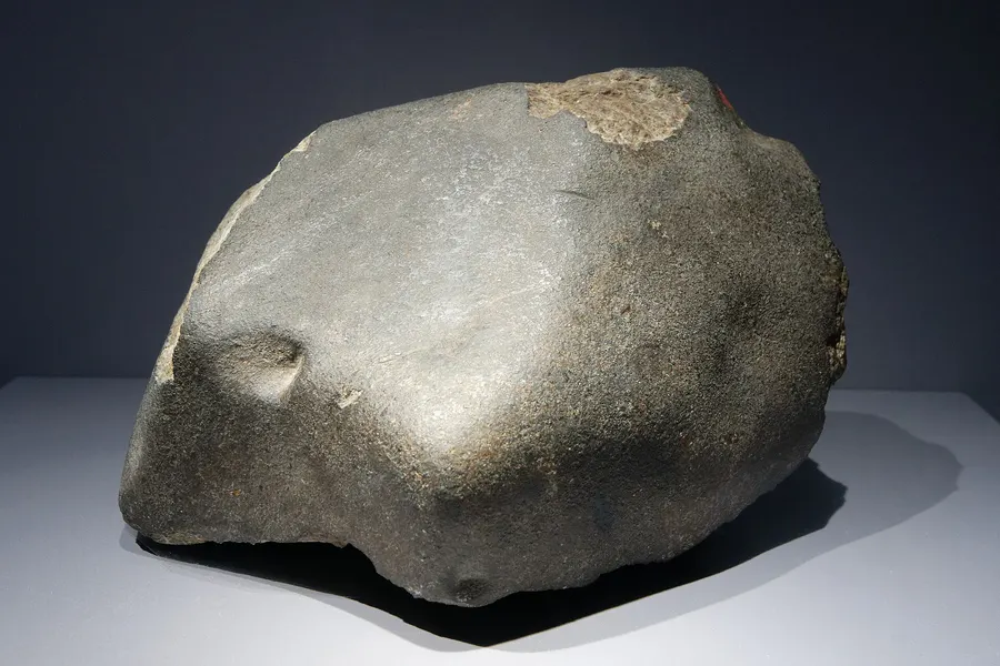 A stone from the L'Aigle fall of 1803, in the mineralogy collection of the Muséum national d'Histoire naturelle, Paris.