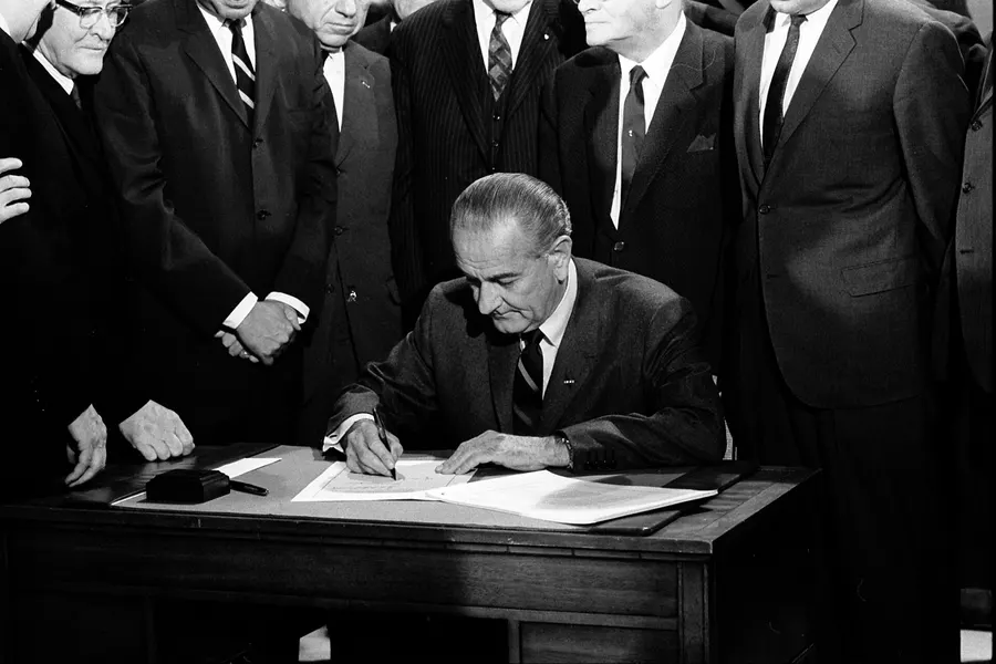 President Lyndon B. Johnson signs the Civil Rights Act of 1968, photographed by Warren K. Leffler.