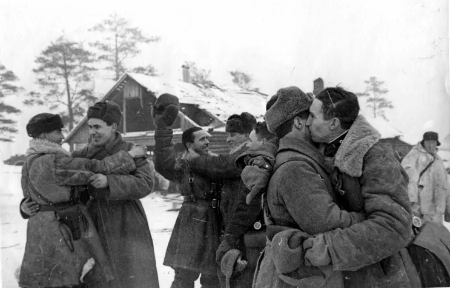 Soldiers and commanders of the Volkhov and Leningrad fronts meet at Workers' Settlement No. 1 as the blockade is broken, January 1943 (TASS photograph).