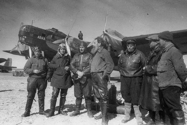 Members of the 1937 Soviet North Pole expedition beside one of their aircraft