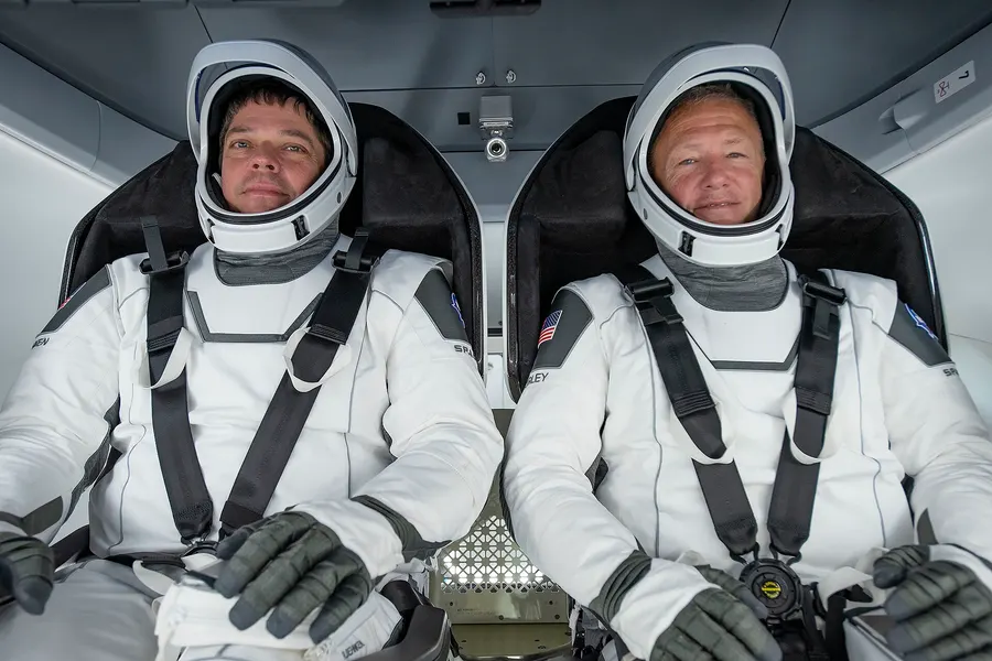 NASA astronauts Bob Behnken and Doug Hurley, the crew of the Demo-2 flight, seated in their Crew Dragon capsule