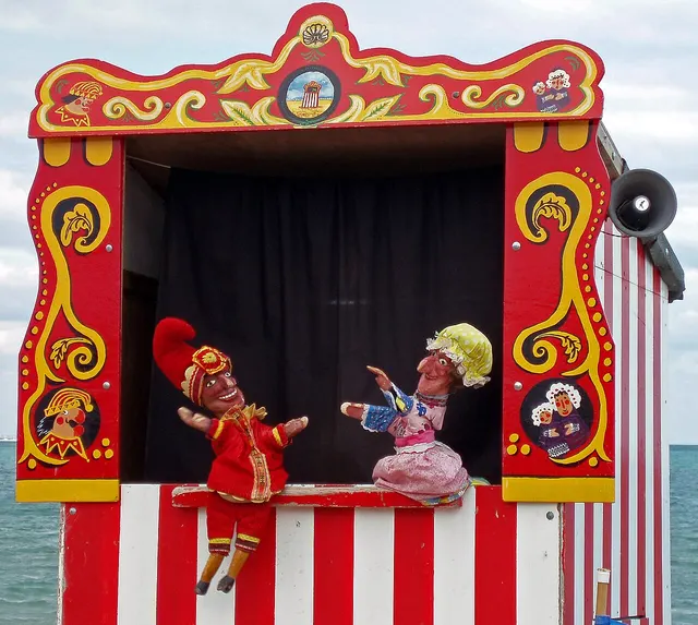 A traditional Punch and Judy booth on the seafront at Swanage, Dorset.