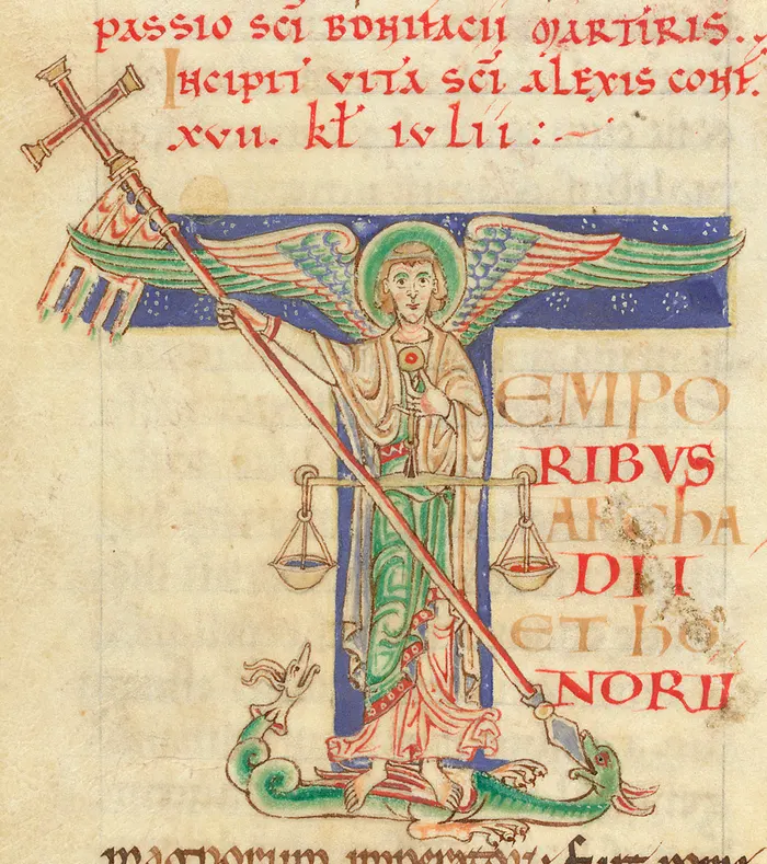 St Michael weighing souls and slaying a dragon, in a 12th-century English manuscript initial.