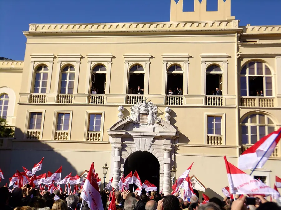 Crowds with flags outside the Prince's Palace on Monaco's National Day, 2010.