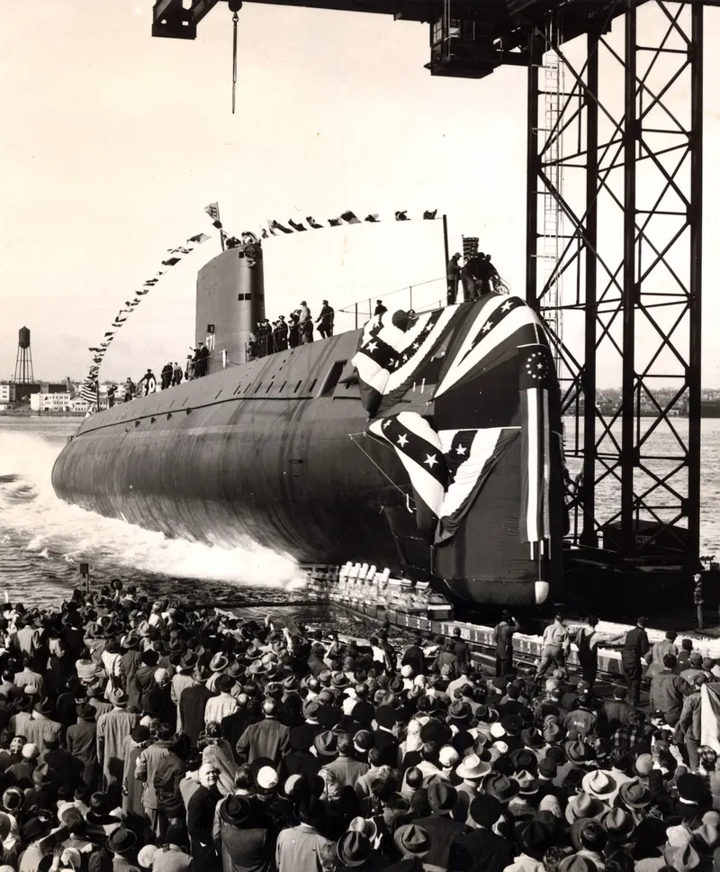 USS Nautilus slides into the Thames River at Groton, Connecticut, 21 January 1954.