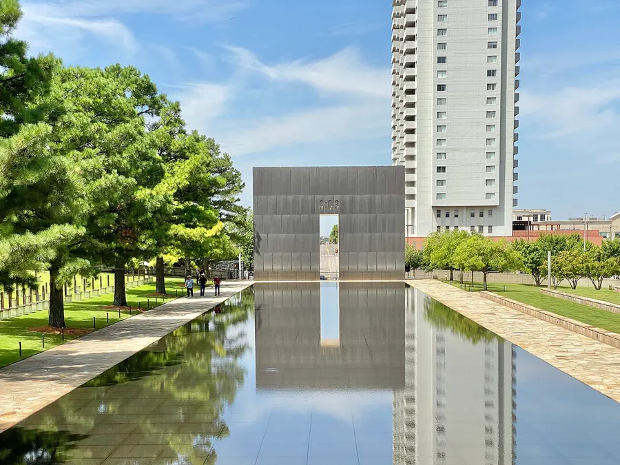 The reflecting pool and the Gate of Time at the Oklahoma City National Memorial.