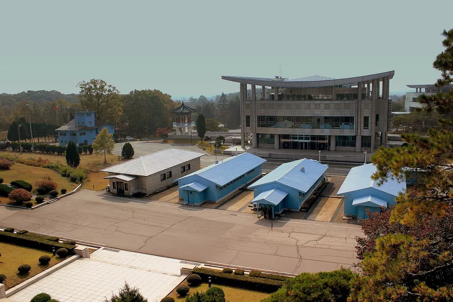The blue conference huts on the line at Panmunjom, with the South Korean side's buildings behind, in 2012.