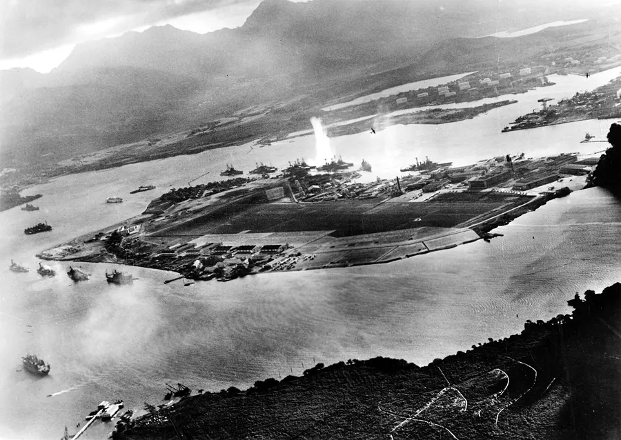 Ships moored around Ford Island, photographed from a Japanese plane shortly after the attack began.