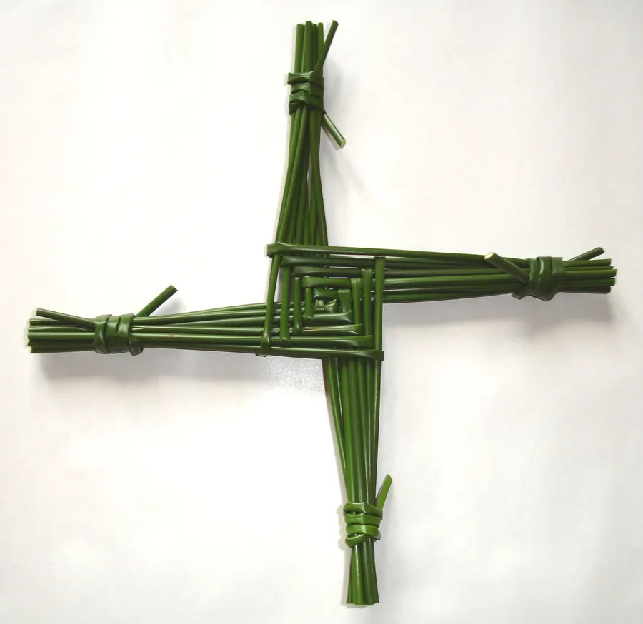 A Saint Brigid's cross woven from green rushes.