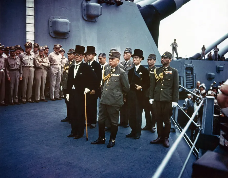 The Japanese delegation stands on the deck of USS Missouri in Tokyo Bay during the surrender ceremony on 2 September 1945